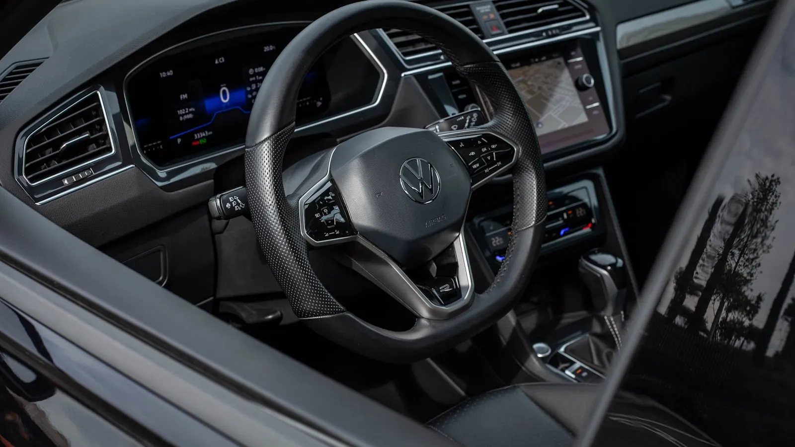 Modern car interior with a digital dashboard and steering wheel